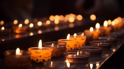 lit candles in a dark environment