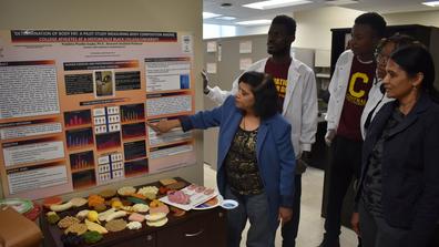 Central State University research associate professor of food, nutrition and health Pratibha Gupta, Ph.D., in her lab with student researchers