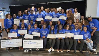 a large group of students from historically black colleges and universities wearing blue shirts pose for a photo after the Third Annual Zero Hunger Zero Waste Innovation Challenge