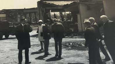 black and white photo of people gathering outside the central state university post office after 1974 tornado