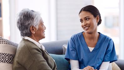 community health worker in a home with an older adult