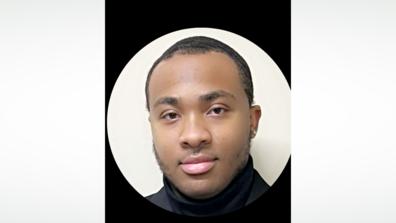 a young black man in a turtleneck sweater