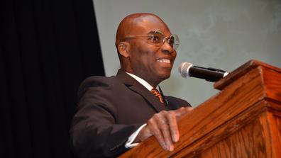 dr. morakinyo a.o. kuti at a podium