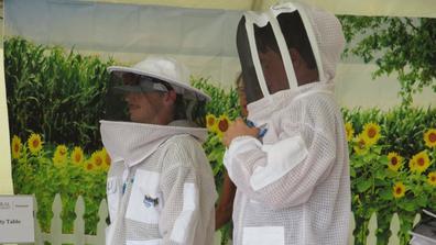 central state university researchers wear protective bee suits at farm science review