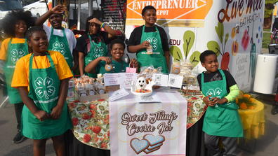 Young entrepreneurs at their goodies table, enticing many Homecoming attendees with sweet teeth that passed by.