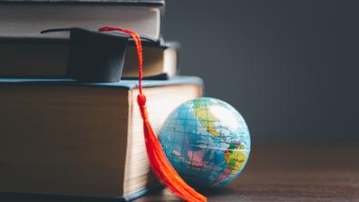 Graduation cap with Earth globe