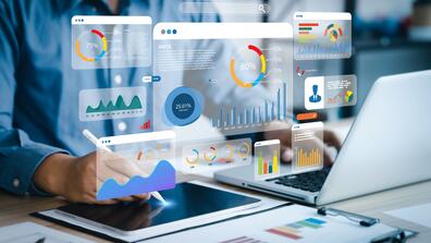 An analyst uses a computer and dashboard for data business analysis and Data Management System with KPI and metrics