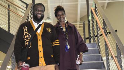 two staff members at central state university one wearing a divine nine black greek letter organization sweater