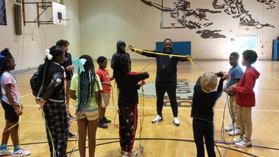 shaun hamilton and youth jumping rope during the just jump 4-H program with Central State University Extension