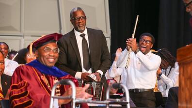 a band student cheers excitedly as dr. alvin level director of bands is inducted into the central state university alumni achievement hall of fame