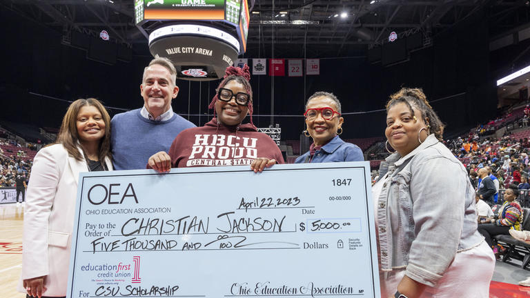 Ohio Education Association’s Assistant Executive Director Airica Clay, Ohio Education Association Vice President Jeff Wensing, Christian “Chrissy” Jackson, Central State University College of Education Interim Dean Lillian Drakeford, and Chrissy's mother, Shonda Peavy. The group is holding a large check made out to Chrissy totaling $5,000 for the top Aspiring Educator Scholarship. The scholarships were presented in Columbus on April 22.