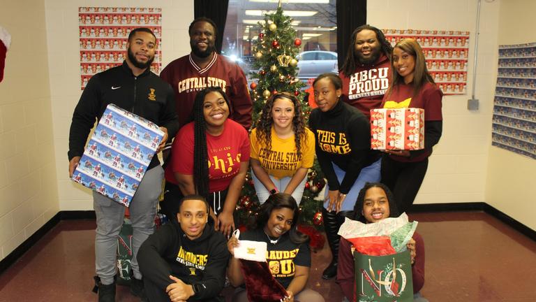 Central State students holding gifts for Christmas
