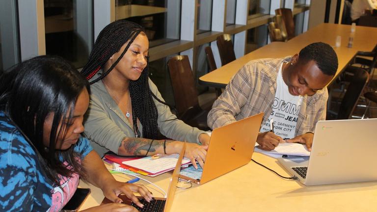 Three Central State University students studying together with their laptops