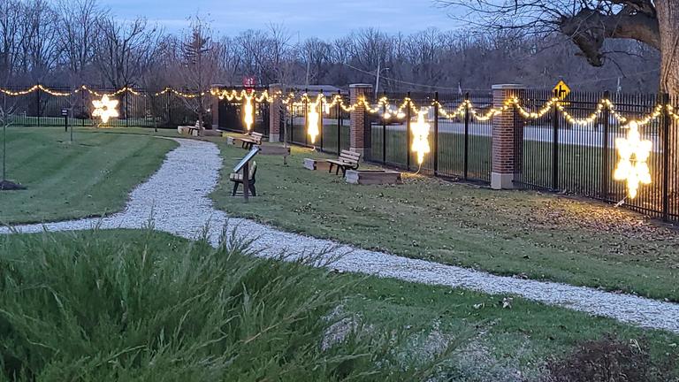 lights illuminate a walking path at the seed to bloom garden