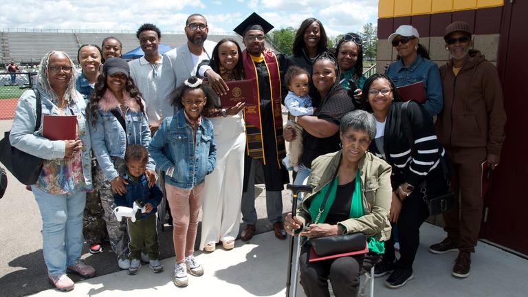 a big group of supporters with a central state university graduate
