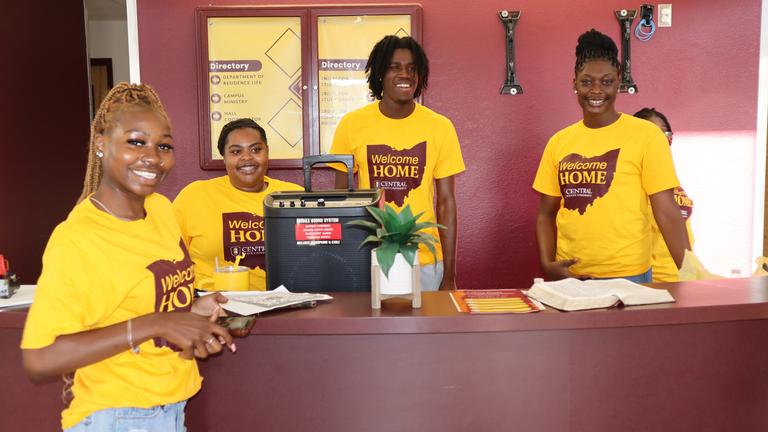 four students welcome their peers back to central state university