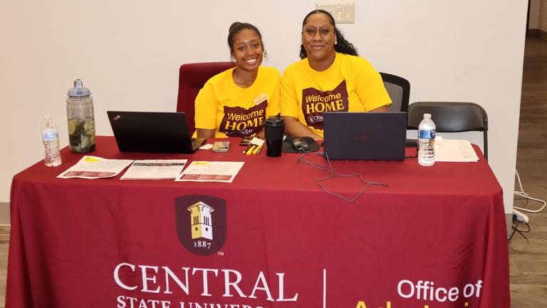 staff members from the office of admissions check in students