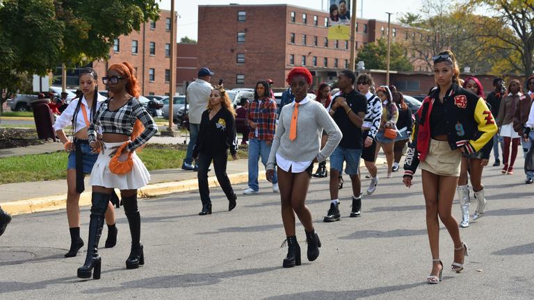 fashion club members march in the parade