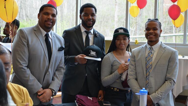 four students celebrate career services signing day