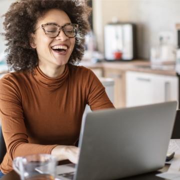 Woman sitting in front of an open laptop