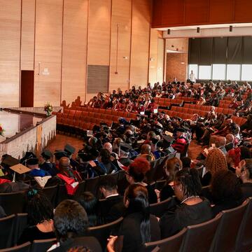 a large group of people sit inside Paul Robeson Cultural and Performing Arts Center at Central State University in Wilberforce Ohio