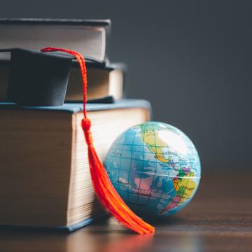 Graduation cap with Earth globe