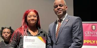 A scholarship recipient from Detroit stands with Central State University President Jack Thomas, Ph.D., on an Admissions recruiting tour.