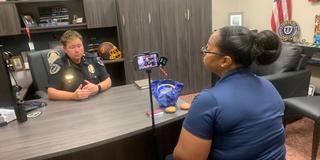 Central State University Police Chief Stephanie Hill interviews on a cellphone camera with Spectrum News 1 on campus safety