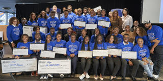 a large group of students from historically black colleges and universities wearing blue shirts pose for a photo after the Third Annual Zero Hunger Zero Waste Innovation Challenge