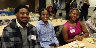 three central state university students at a meal with Marauder Land Media Group