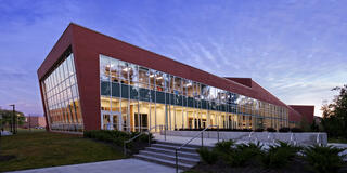 central state university student center lit up in the evening