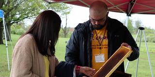 a central state university researcher displays some of the research at the 2023 land-grant open house at central state university