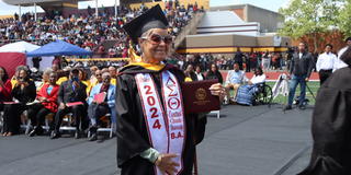 arline flournoy at age 82 wearing regalia on her 2024 graduation day at the football stadium at central state university