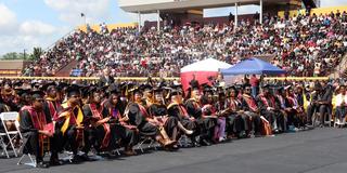 central state university class of 2024 on the football field with a packed stadium