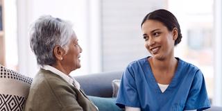 community health worker in a home with an older adult