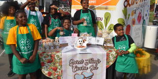 Young entrepreneurs at their goodies table, enticing many Homecoming attendees with sweet teeth that passed by.