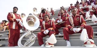 members of the invincible marching marauders marching band at central state university in the stands at the 2024 homecoming game