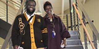 two staff members at central state university one wearing a divine nine black greek letter organization sweater