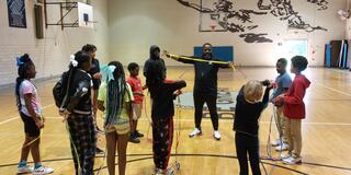 shaun hamilton and youth jumping rope during the just jump 4-H program with Central State University Extension