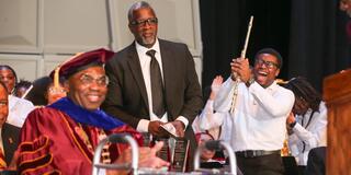 a band student cheers excitedly as dr. alvin level director of bands is inducted into the central state university alumni achievement hall of fame