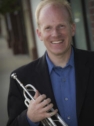 Chris Braun holding trumpet