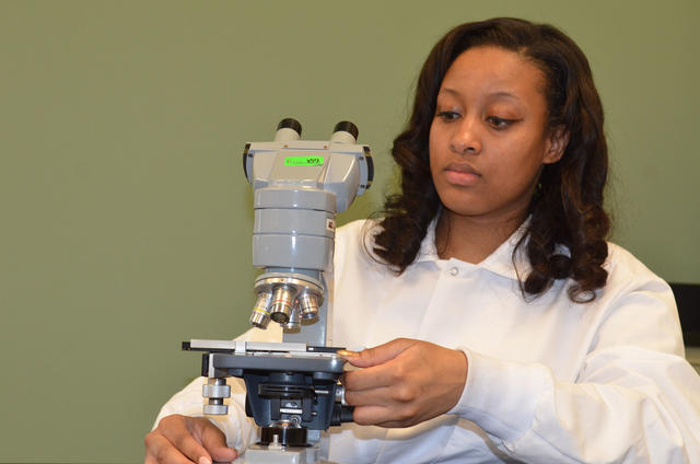 STEM student at the microscope