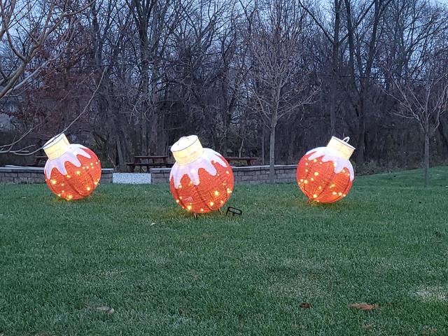 three large outdoor winter ornaments at the seed to bloom botanical and community garden