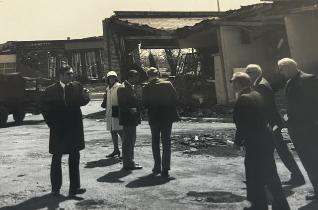 black and white photo of people gathering outside the central state university post office after 1974 tornado
