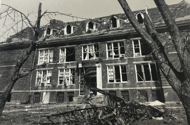 bundy hall roof destroyed after 1974 tornado with roof of library in the foreground