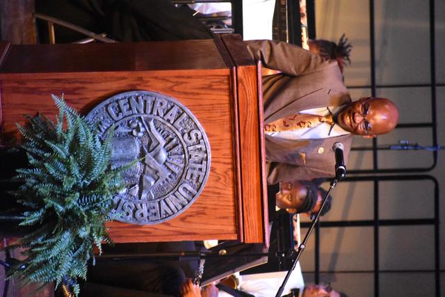 dr. morakinyo a.o. kuti stands at a podium with the central state university seal