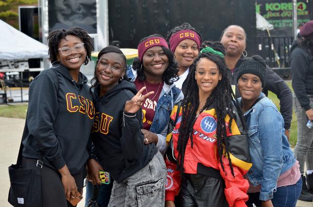 a group of seven central state university marauders gather for a photo at homecoming