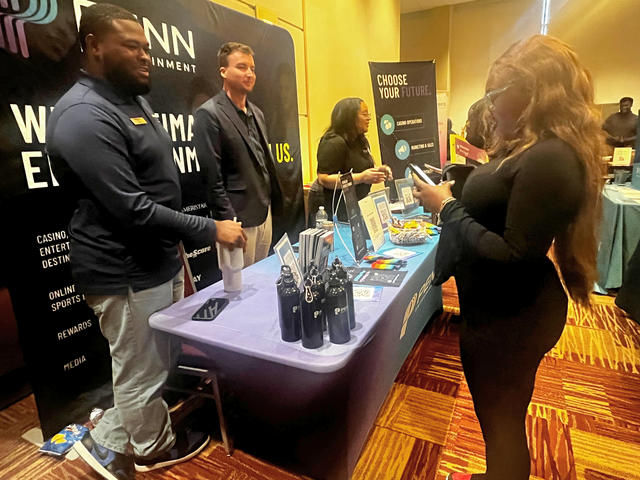 Alisha Anderson speaks with charles hill at the career expo at central state university