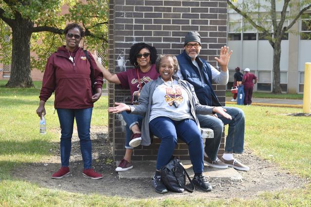 four central state university graduates in the crowd during the homecoming parade