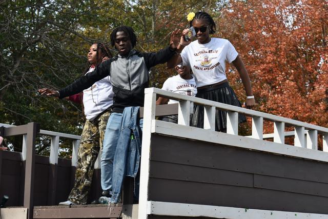 pirate ambassadors dance on a float during the 2024 central state university homecoming parade